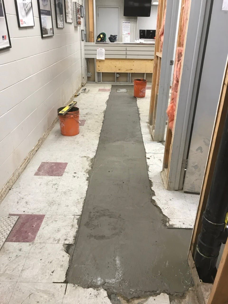 A full sewer replacement trench at an Edmonton industrial shop
